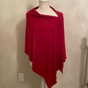 Red Poncho made with spandex/poly material. Fits most sizes.